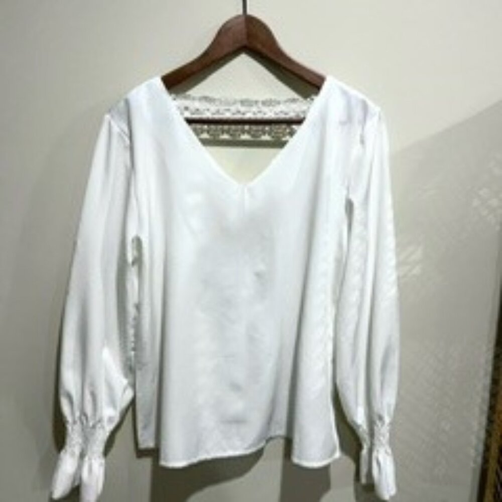 White V-neck blouse with lace back detail